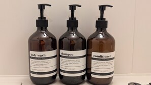 Three bottles of body wash, shampoo, and conditioner. - CHECK inn Osaka Shin-Sekai (Osaka)