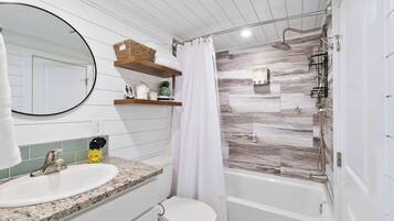 Shower, hair dryer, towels, shampoo
