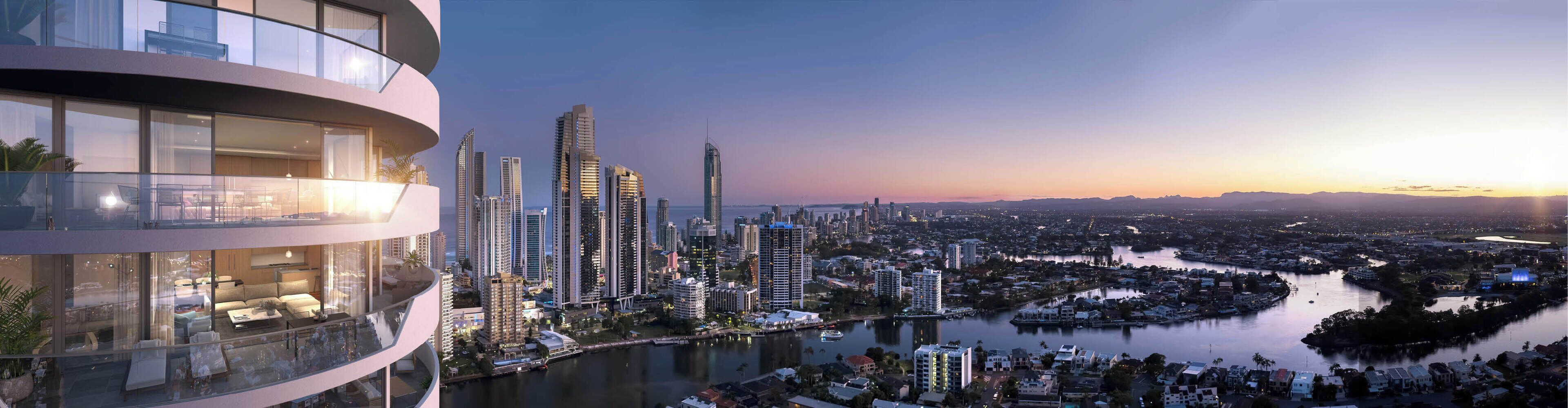 Ein modernes Hochhaus mit Glasfassade, ein Fluss und eine Skyline im Hintergrund.