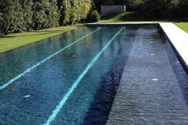 3 lane lap pool. 75' with a beach for pool chairs. Crystal clear salt water.
