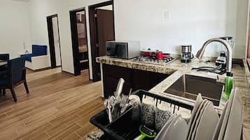 Family Apartment, Non Smoking | Private kitchen | Mini-fridge, microwave, stovetop, cookware/dishes/utensils