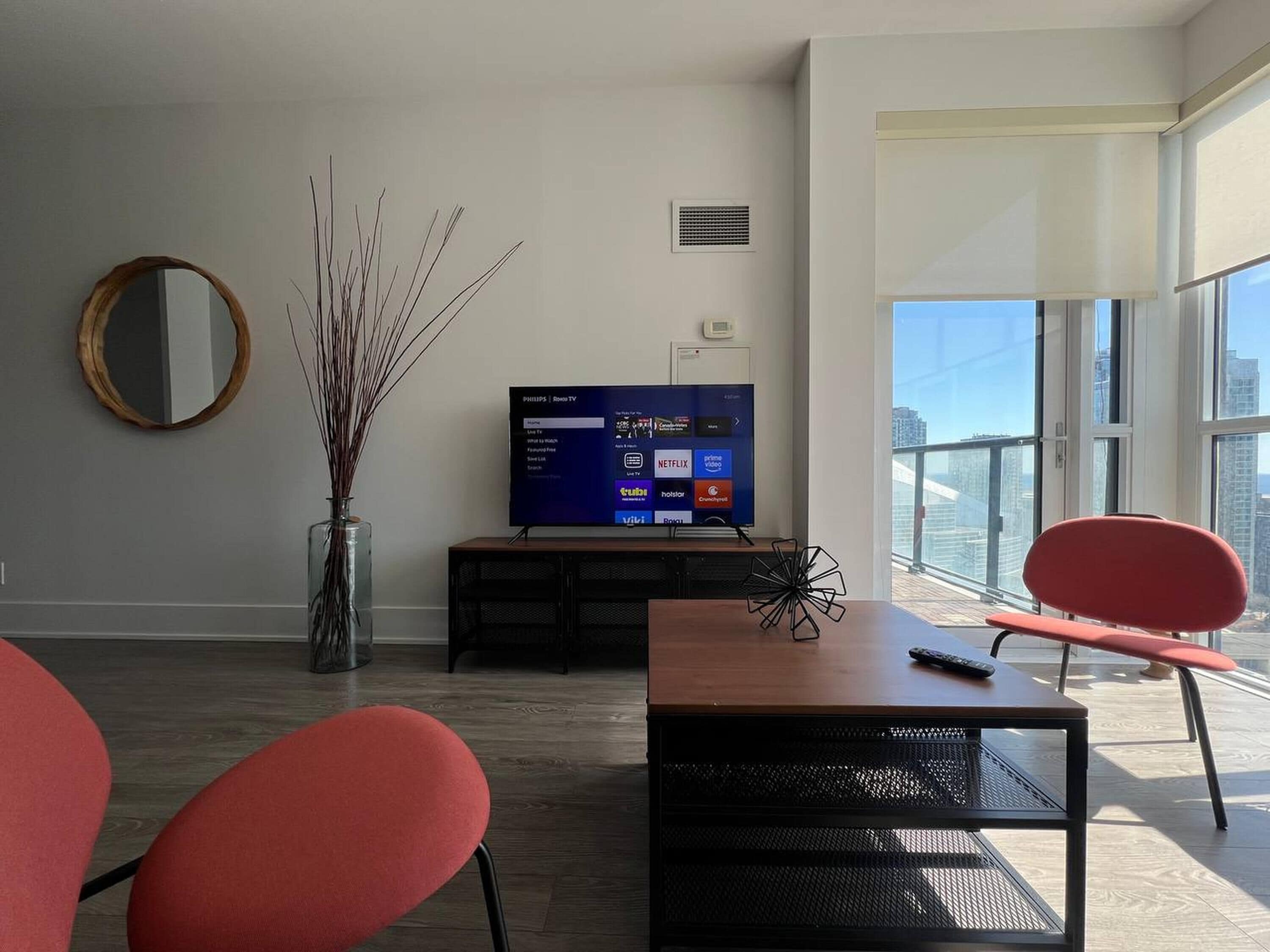 Deluxe Suite, Multiple Beds | Living area | 50-inch flat-screen TV with digital channels