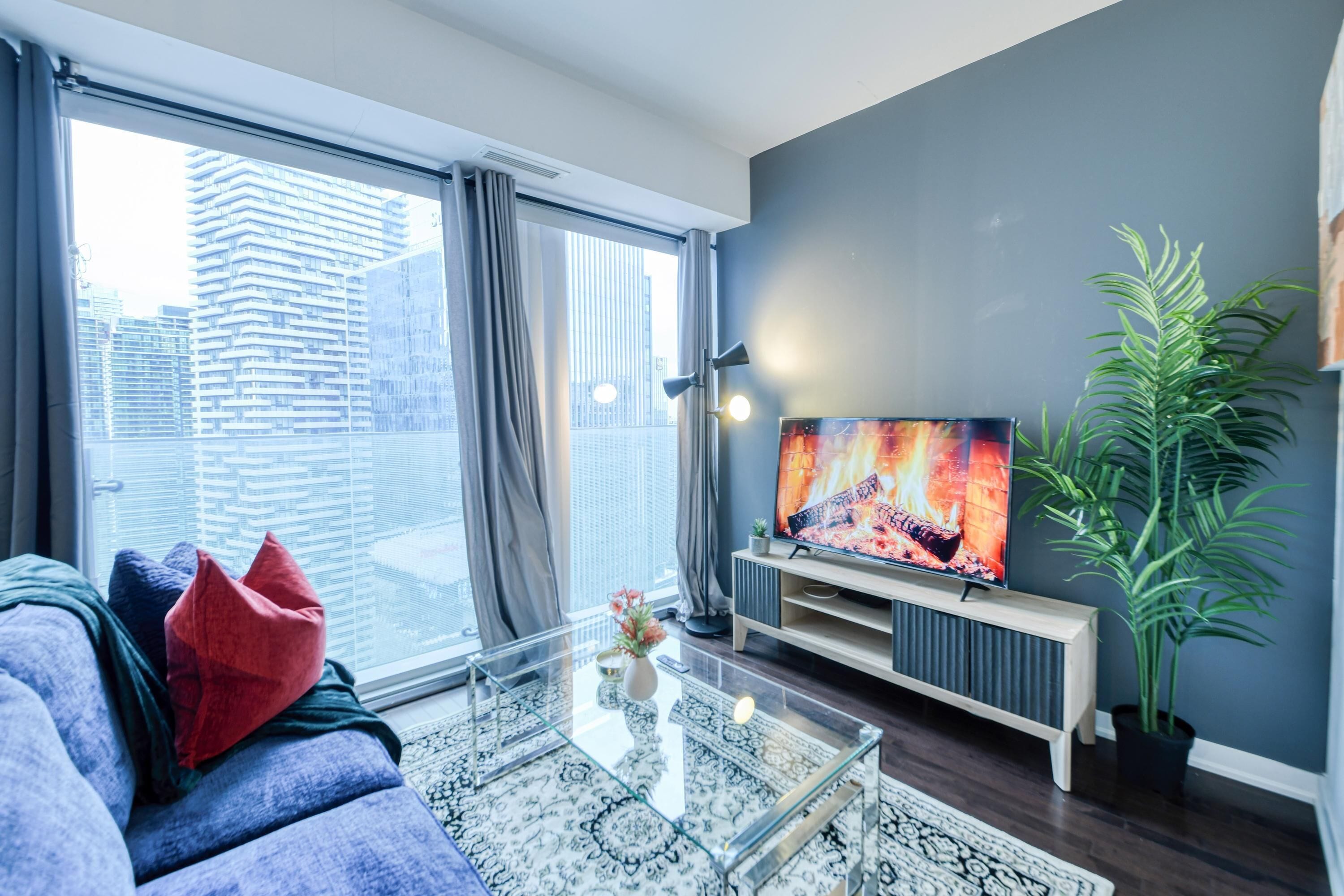 Exclusive Suite, 1 Bedroom | Living area | 50-inch flat-screen TV with digital channels