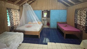 A room with a wooden ceiling, a bed with a canopy, a small table, and a bench.