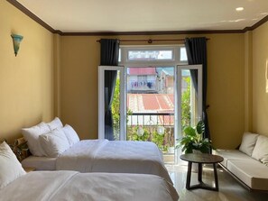 Deluxe Quadruple Room, Balcony, City View | Blackout curtains, soundproofing, iron/ironing board, free WiFi - CozyNook Boutique Apartments (Da Lat)