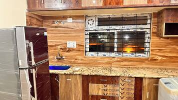 Fridge, stovetop, dining tables