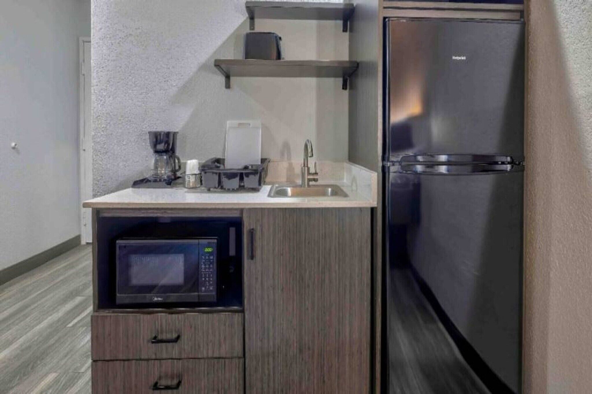 Fridge, microwave, stovetop, coffee/tea maker