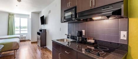 Fridge, microwave, stovetop, coffee/tea maker