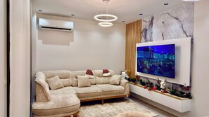 Basic Apartment, 1 Bedroom, Balcony | Living area | 65-inch Smart TV with digital channels, video game console - Arjola Cozy Stay (Korçë)