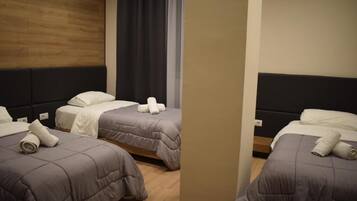 Standard Triple Room, Garden View | Desk, laptop workspace, free WiFi