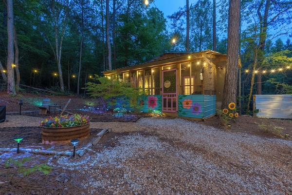 Soak beneath a canopy of cascading blooms and twinkling lights.