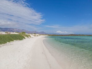 On the beach, sun loungers, beach towels
