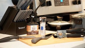 A kitchen counter with a knife block, a pepper grinder, a bottle of salt, and a rolling pin. - King Suite - 10 min to Ft Moore (Columbus)