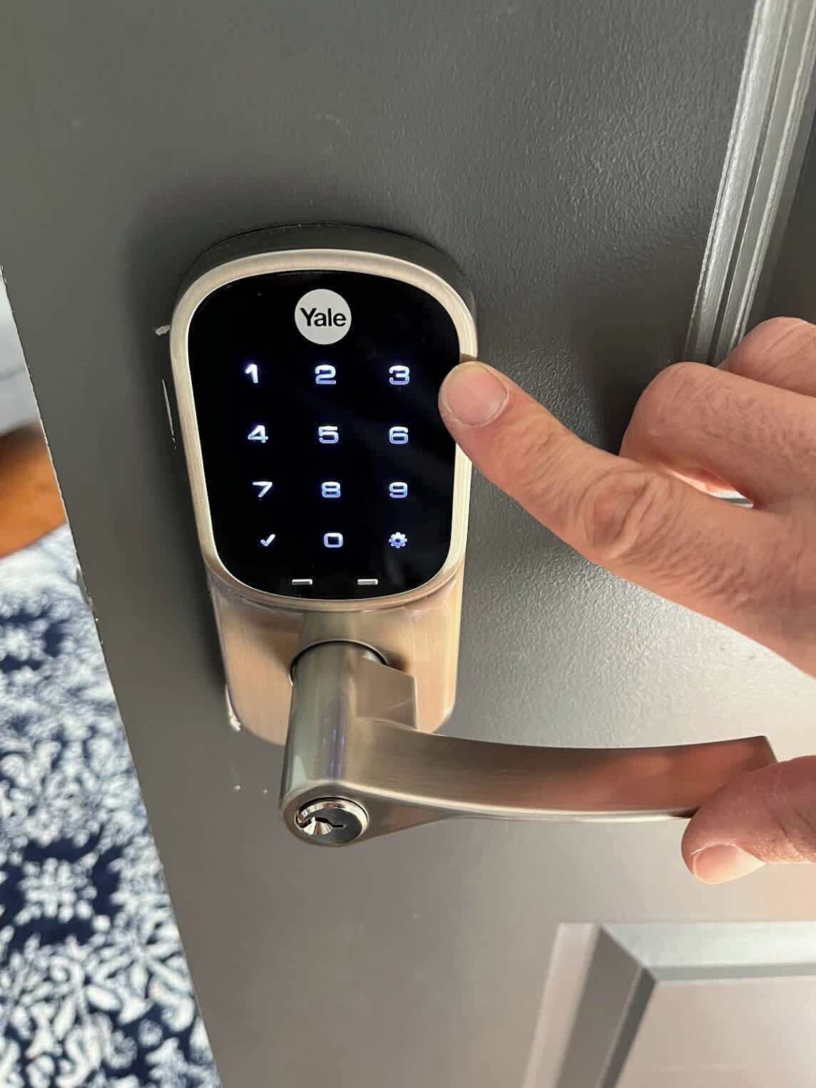 A Yale smart lock on a door handle.