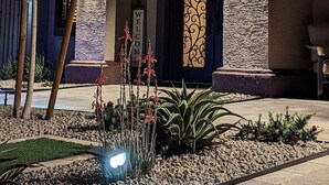 A building with a stone facade, arched windows, and a welcoming sign. - 647 5 Bedrooms Hot Tub Firepit BBQ Kitchen (Glendale)
