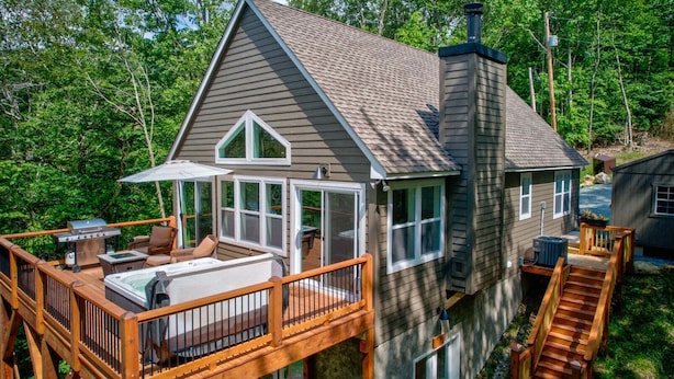A house with a deck, a hot tub, and a chimney. - Lessons From Mars (Banner Elk)
