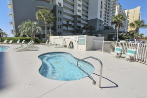 A swimming pool area with lounge chairs and a no diving sign. - Long Beach Tower 3, #1303 (Panama City Beach)