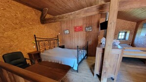 A rustic wooden room with a bed, a desk, and a chair. - Chateau de Vermette: wedding, seminars, master class, long term rental possible (Argentonnay)