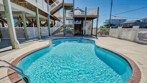 A swimming pool with a wooden deck, a staircase, and a white fence. - Surf City Stay – Motel Unit - Walk to Beach (Surf City)