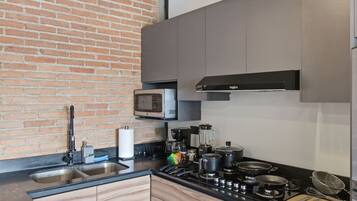 Fridge, microwave, stovetop, coffee/tea maker