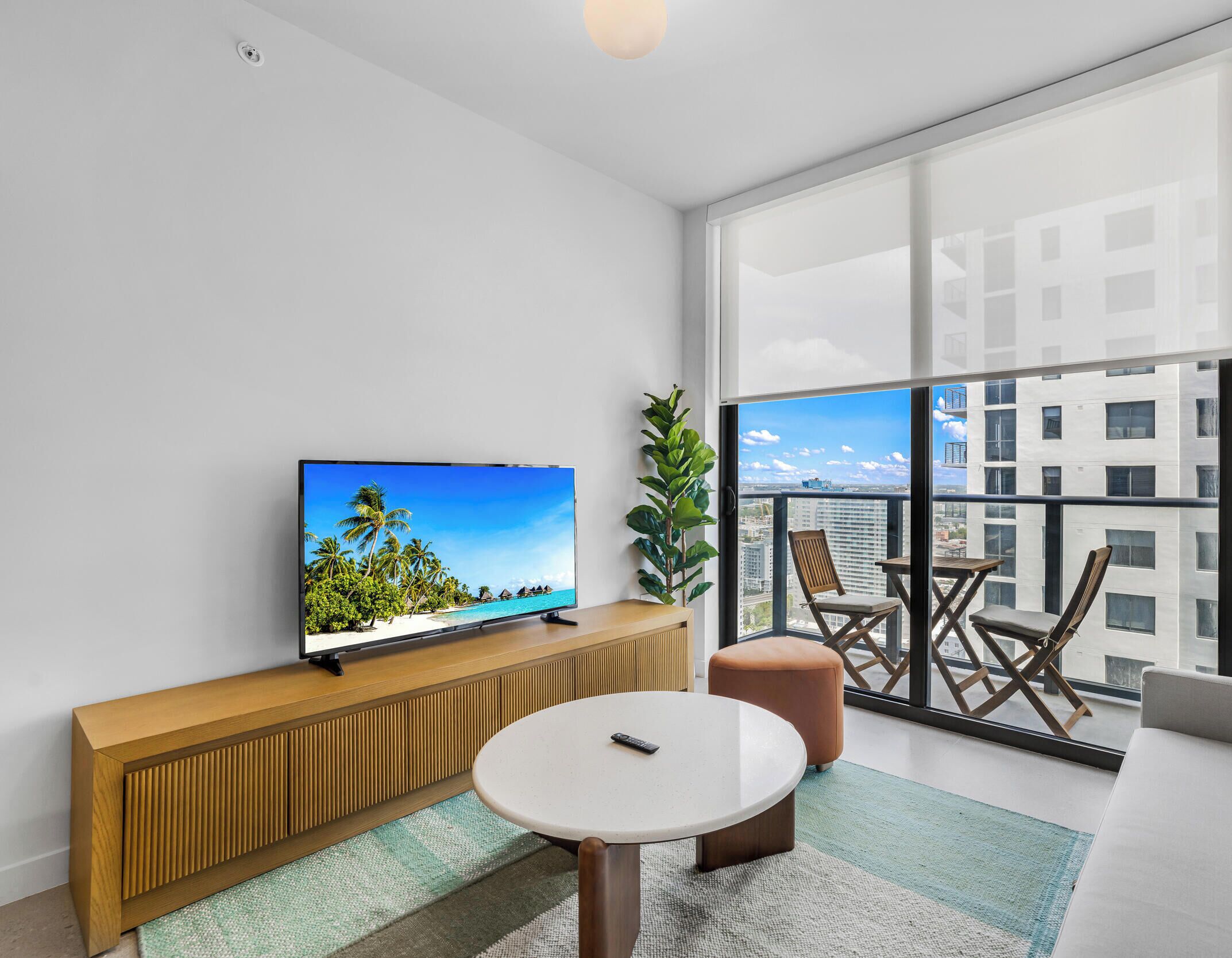 Condo, Balcony, City View | Living area | 36-inch Smart TV with cable channels