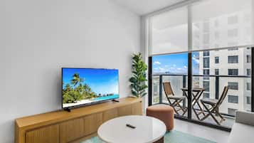 Condo, Balcony, City View | Living area | 36-inch Smart TV with cable channels