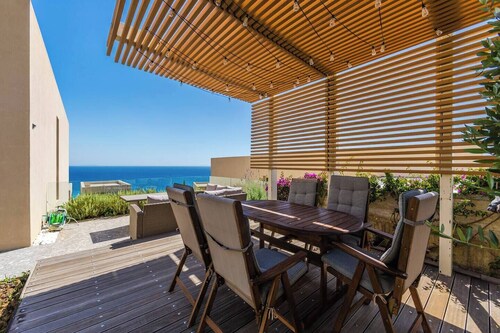 Sea View Panorama | Green Coast 2BR Patio Retreat by PikHost