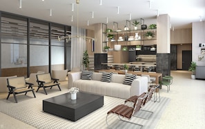 A modern living room with a sofa, coffee table, and seating area.