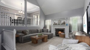A living room with a fireplace, a sofa, a coffee table, and a television.