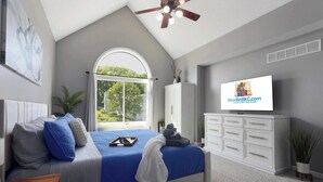 A bedroom with a bed, a television, a window, a ceiling fan, and a cabinet.