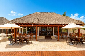 Outdoor dining - Spacious 2BR Cana Pearl Condo, King Bed, Pool & Golf Views (Punta Cana)