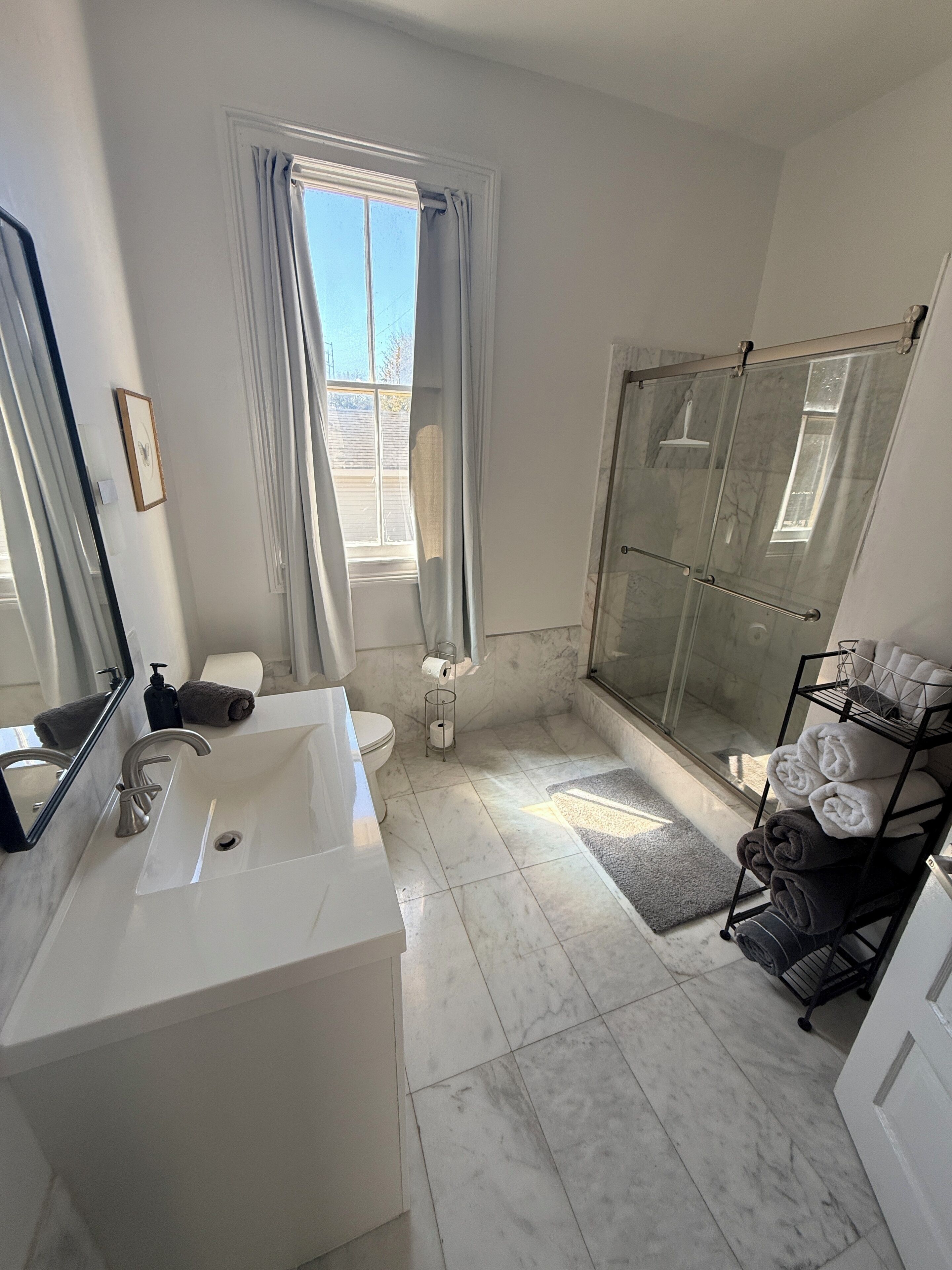 Shower, hair dryer, towels, soap