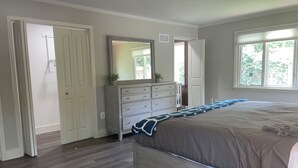 A bedroom with a bed, dresser, mirror, and a window. - Prime  Bethesda Location Easy Access to DC (Bethesda)