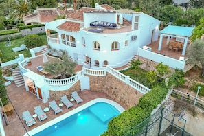 A multi-story house with a pool, outdoor seating, and a patio area. - Miramar - By Almarina Villas (JÁVEA)