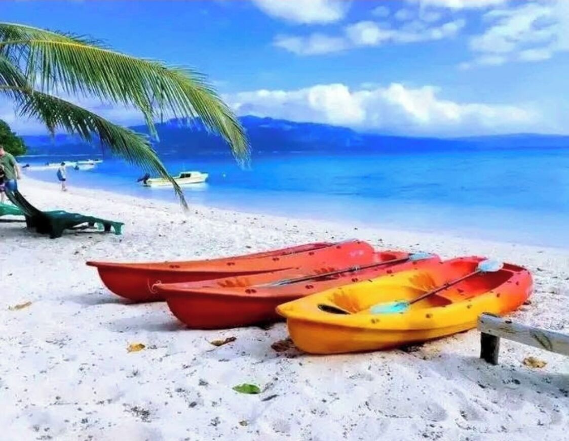 Beach nearby, black sand, beach towels