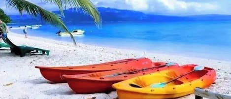 Beach nearby, black sand, beach towels