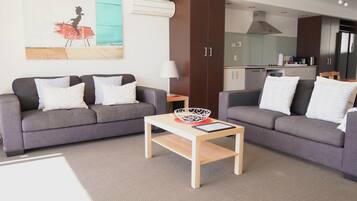 Deluxe Apartment, Balcony, Beach View | Living area