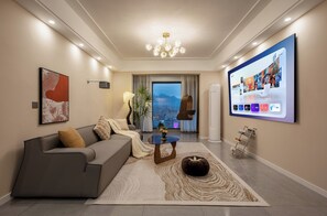 Comfort Apartment, 3 Bedrooms, Kitchen, Mountain View | Living area | 100-inch TV with cable channels, Netflix, streaming services - Local Vibe Downtown Guesthouse (Zhangjiajie)