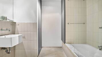 Shower, hair dryer, towels, shampoo