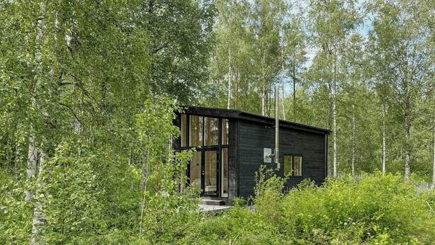 A modern cabin surrounded by dense forest. - Timeless home with nature at your doorstep (Arvika)