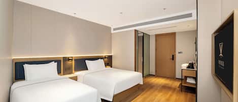 Family Triple Room, Courtyard View | Desk, blackout curtains, soundproofing, free WiFi