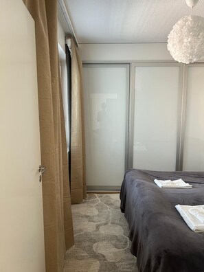 Desk, laptop workspace, blackout curtains, iron/ironing board - Modern Nordic 2BR Apt in Kuopio Center (Kuopio)