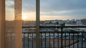 A cityscape with a view of a highway and a bus station.