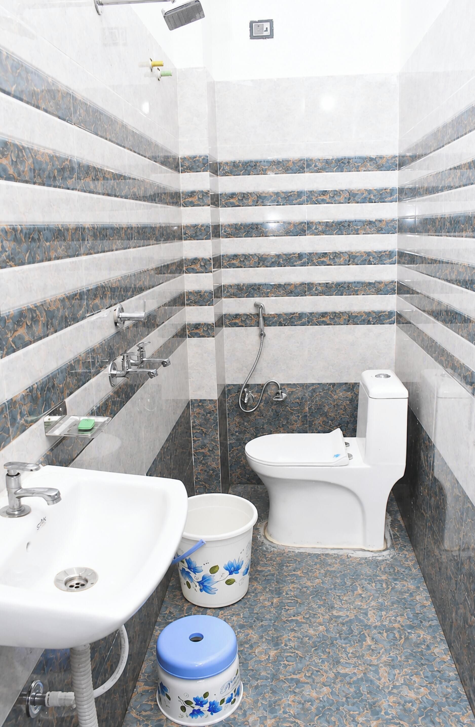 Shower, rainfall showerhead, slippers, towels