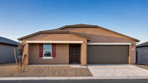 A single-story house with a garage, a front door, and a small window with shutters. - Spacious 4BR Rental near Downtown Prescott (Prescott Valley)