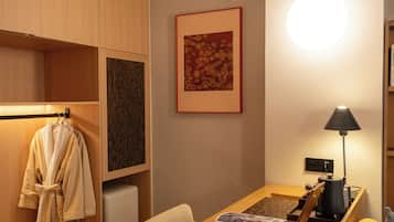 Deluxe Room | Living area | Smart TV, smart speakers, computer monitors, printers