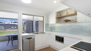 Microwave, oven, stovetop, dishwasher - Poolside Family Retreat by HolidayCo. (BERKELEY VALE)