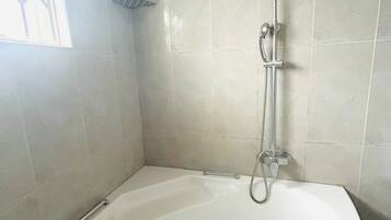 Shower, towels, soap, toilet paper