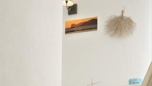 A staircase with white walls and a white railing. - Palau Noal (Alghero)