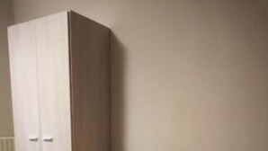 A room with a large wardrobe, a bed, and a small table. - osteria il becco fine affittacamere (Cumignano sul Naviglio)